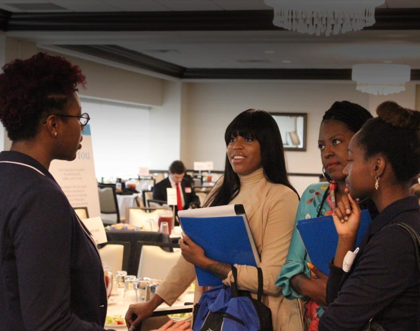 High school students talk with a potential employer at a Career Launch event